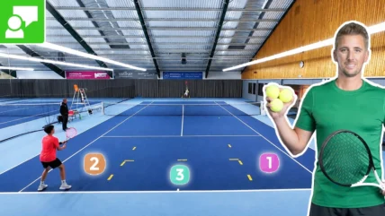 Indoor tennis court with players practicing; a large cutout man in green holding tennis balls on the right, and three numbered targets on the court for training.